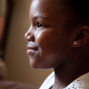 Profile of a smiling girl's face. thumbnail