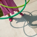 Student plays with hula hoops during recess. thumbnail