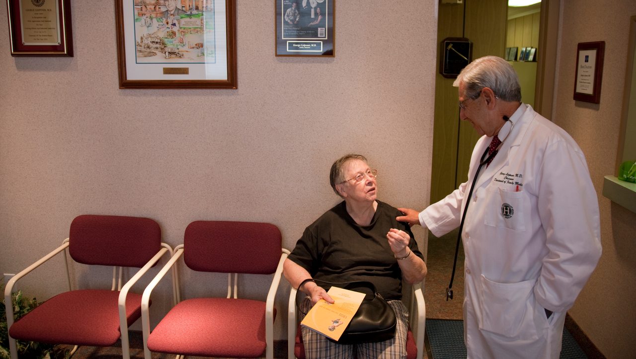 Dr. Leipsner talks with a patient in the waiting room in the office of Dr. George Leipsner in Maywood, NJ.
