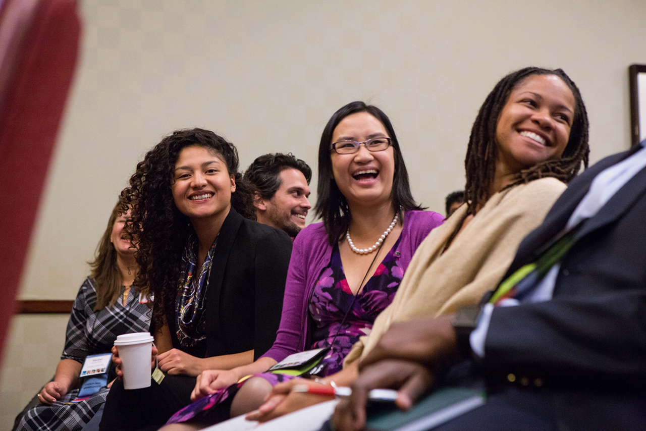 A diverse group attends a workshop.