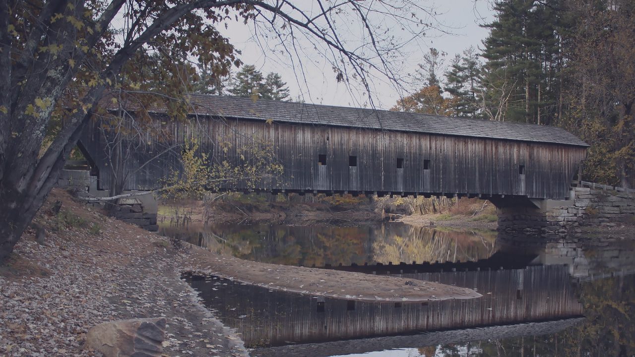 View of an old, wooden covered bridge.