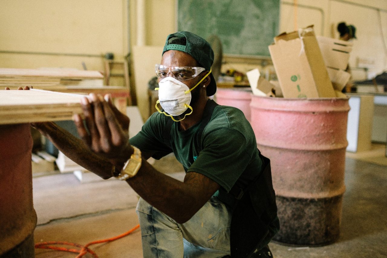 Fort Lauderdale, FL - August 22, 2019 - Chadrick Lindsay (31), an apprentice in the City of Fort Lauderdale Housing Authority's Step Up program, prepares lumber to build cabinetry in the workshop.  The Housing Authority of the City of Fort Lauderdale has operated a state certified Step-Up Apprenticeship Program (Step-Up) since 1994. The objective of the program is to provide apprentices with the opportunity to create a portfolio of education, training, and employment skills to increase their potential for permanent employment and economic self-sufficiency. During the two-year state certified program, apprentices are trained in construction skills with a specialty in housing rehabilitation and building maintenance for occupations in the public and private sectors. All apprentices are required to obtain their GED while in the program and certified instructors teach morning and evening classes at the Housing Authority to help prepare the apprentices for the exam.