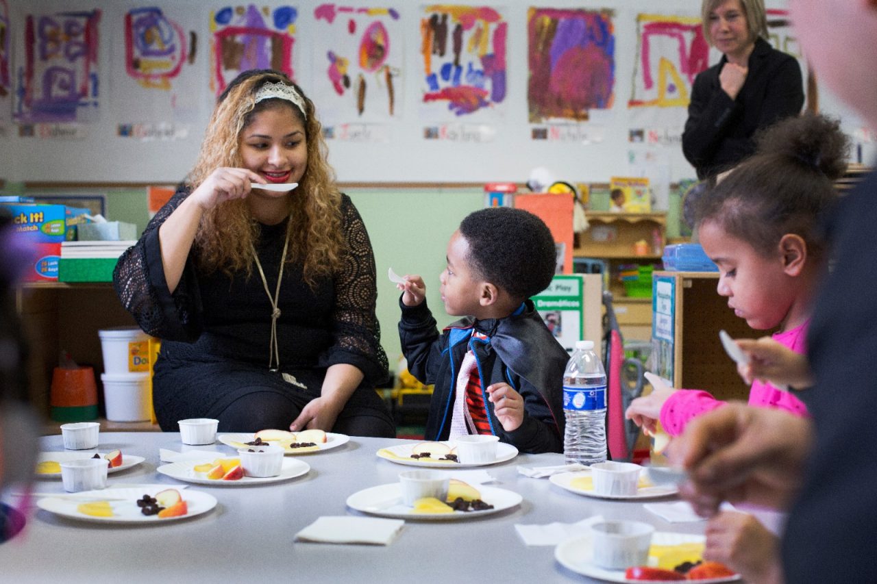 Children and their parents participate in an activity with representatives of the Food Trust at the Center for Family Services Pine Street School in Camden, NJ. Kim Fortunado of Campbell's also participated. Cameden, NJ, (Photo by Samantha Appleton)
