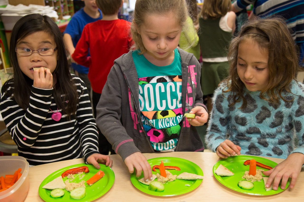 Signs of Progress: Illinois, Children learn about healthy eating during story time and then prepare hummus at William Hammerschmidt Elementary in Lombard, IL.