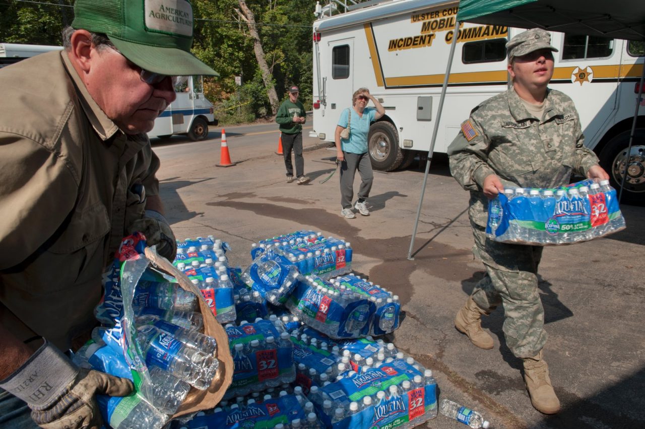 PHOENICIA, NEW YORK - SEPTEMBER 01: New York State National Guardswoman, Jenifer Lafountain (Release #12) and volunteer, Richard Loveless (Release #13) carry relief supplies after flooding hit the many small towns in the Catskills. Hurricane Irene dropped large amounts of rain on the Catskills causing major flooding in many towns and villages. 


RELEASES:

Release #11 : Ernest Lenyhi
Release #12 : Jenifer Lafountain
