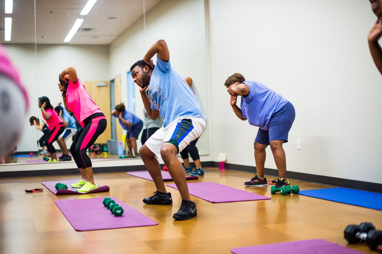 Adults exercising at a community class.