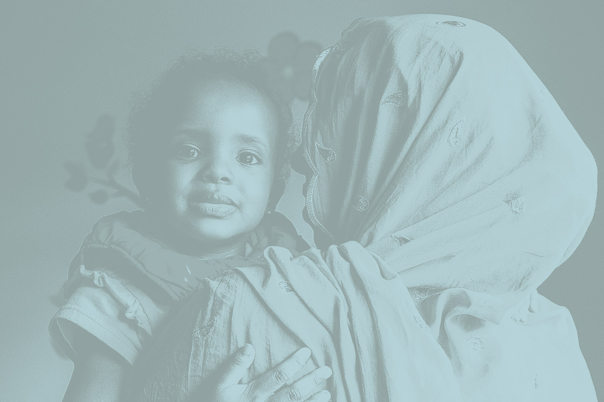 Hinda Ali, 2, hugs her mother Koos Husen at LiveWell Finney County Neighborhood Learning Center in Garden City, Kansas. LiveWell helps refugees and immigrants with health care, housing and job applications and offers classes in English, nutrition and other life skills. Koos is from Somalia and has lived in Garden City for 3 1/2 years.