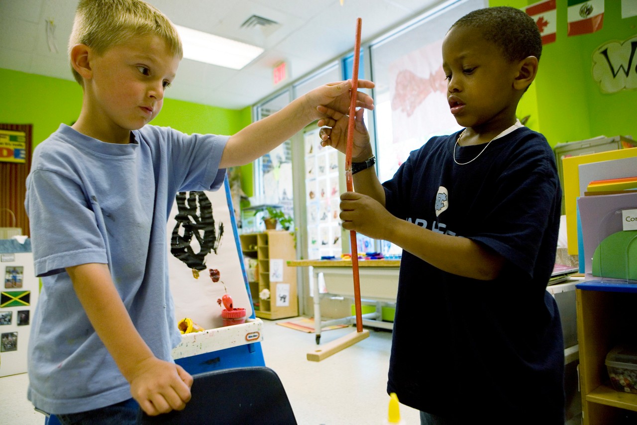 Joshua Singleton and classmate make golf clubs from building toys. Frank Porter Graham Child Development Center. Chapel Hill, North Carolina. Commission to Build a Healthier America. Joshua Singleton and classmate make golf clubs from building toys. Frank Porter Graham Child Development Center. Chapel Hill, North Carolina. Commission to Build a Healthier America.