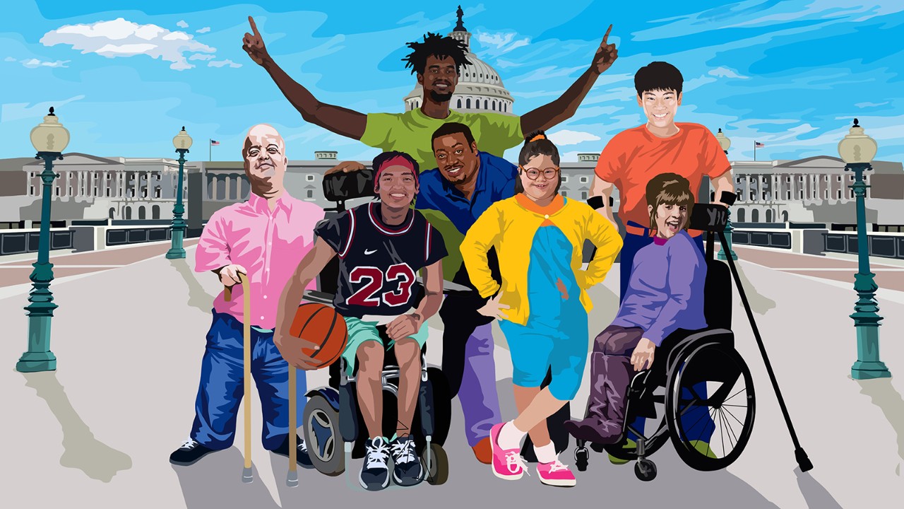 A group of disabled and non-disabled people of various races, ethnicities, genders and ages pose for a group photo.