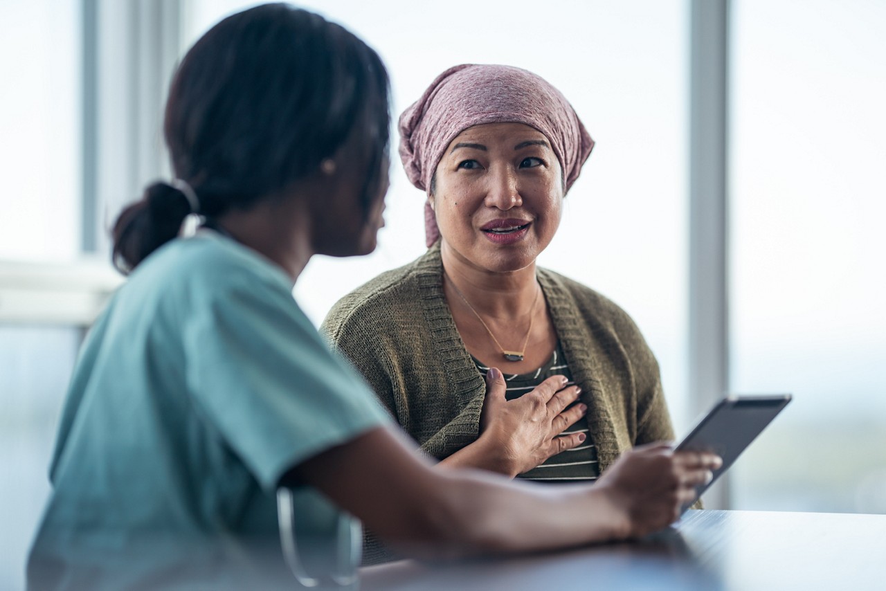 A doctor discusses a treatment plan with a patient. A doctor discusses a treatment plan with a patient.