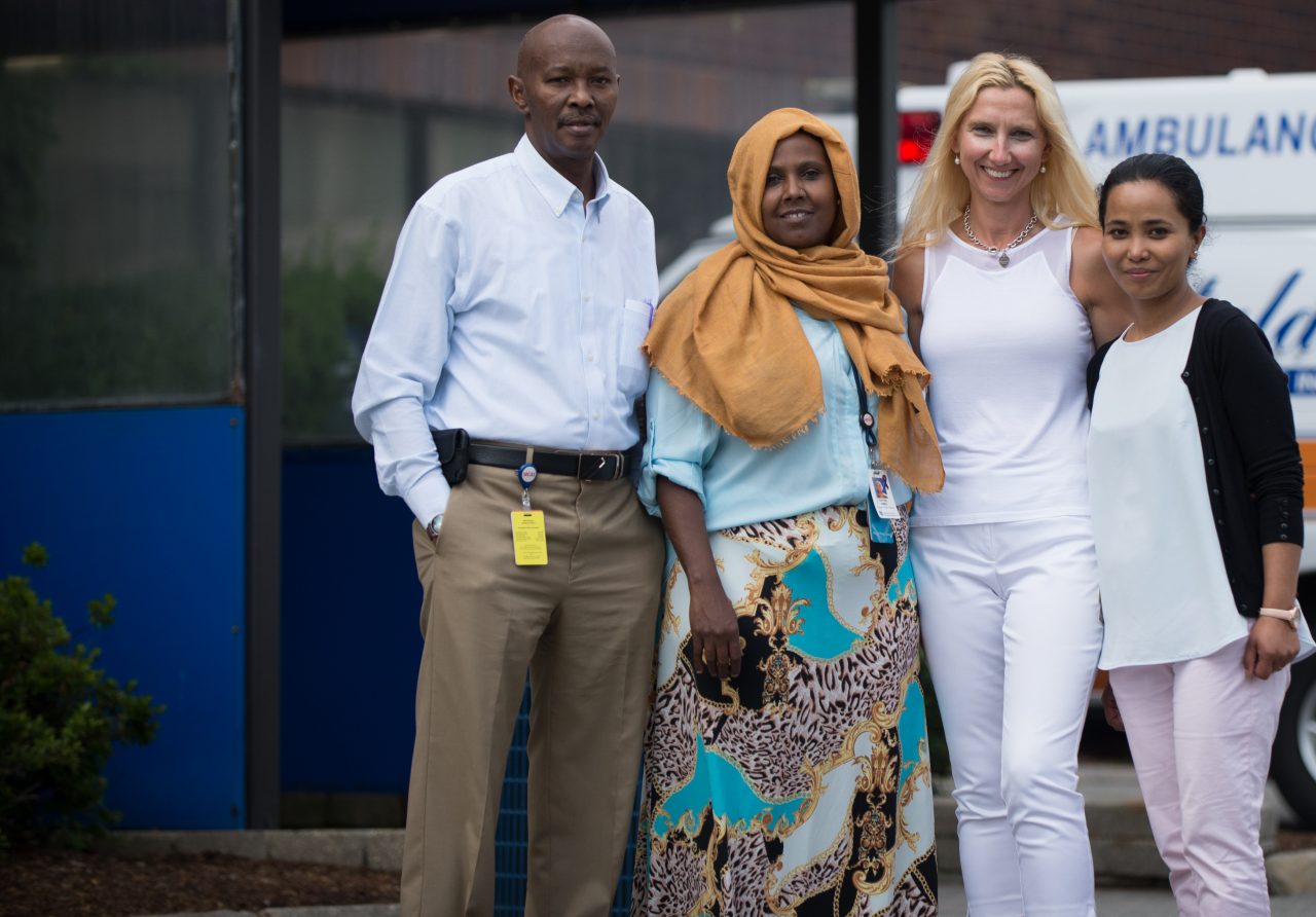 (From left) Ali Abdullahi, Kaftun Ahmed, Franka Miletic, and Anjana Chakkour, members of the team of Community Health Workers at Massachusetts General Hospital's Chelsea Healthcare Center stand in front of the center. The workers seek to reduce healthcare barriers which are posed for patients by language and cultural differences. (AEM Chelsea MA story image)