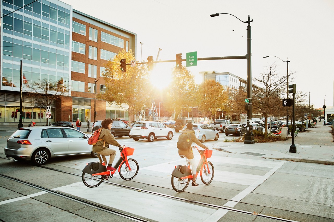 Women commuting on bike share bikes during rush hour Women commuting on bike share bikes during rush hour