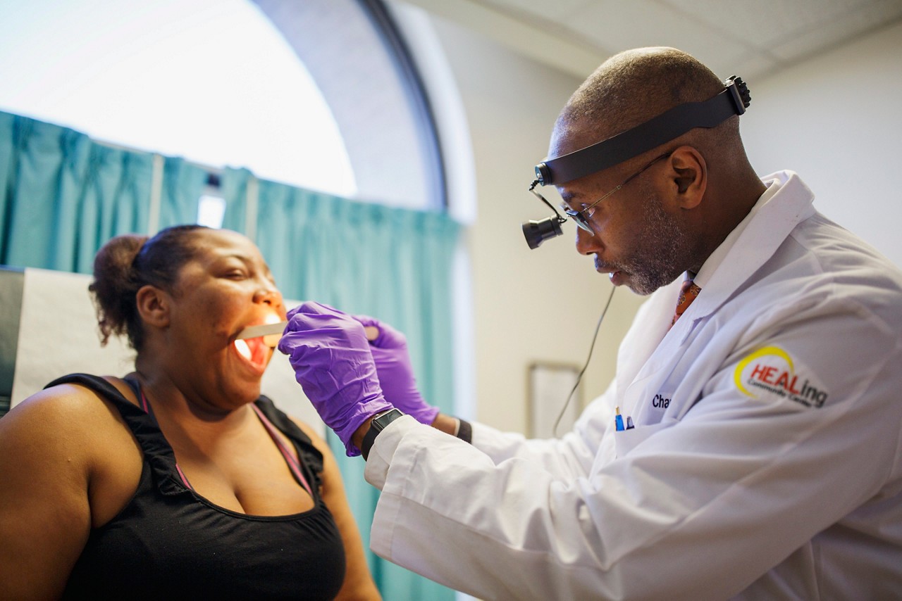 A doctor examining a patient. A doctor examining a patient.