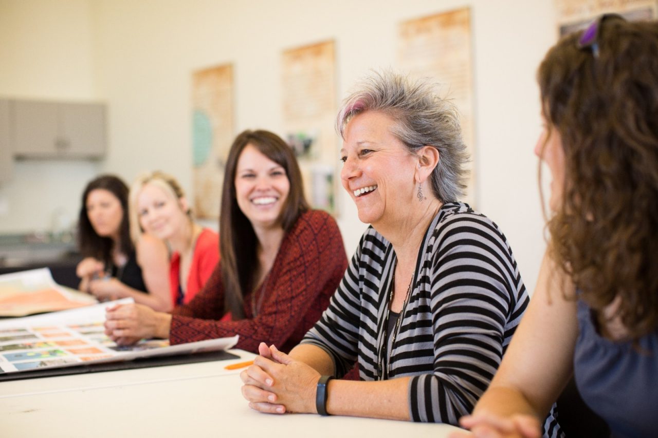 A group of happy women at a meeting.