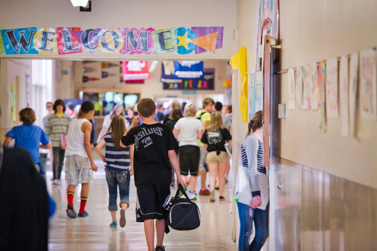 Students walking in a school hallway, where from 2006 to 2013 the Spokane Public Schools’ graduation climbed from 60 percent to nearly 80 percent.