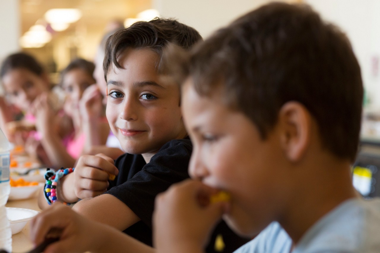 Students eating lunch at Lighthouse Summer Program in Bridgeport, Conn.