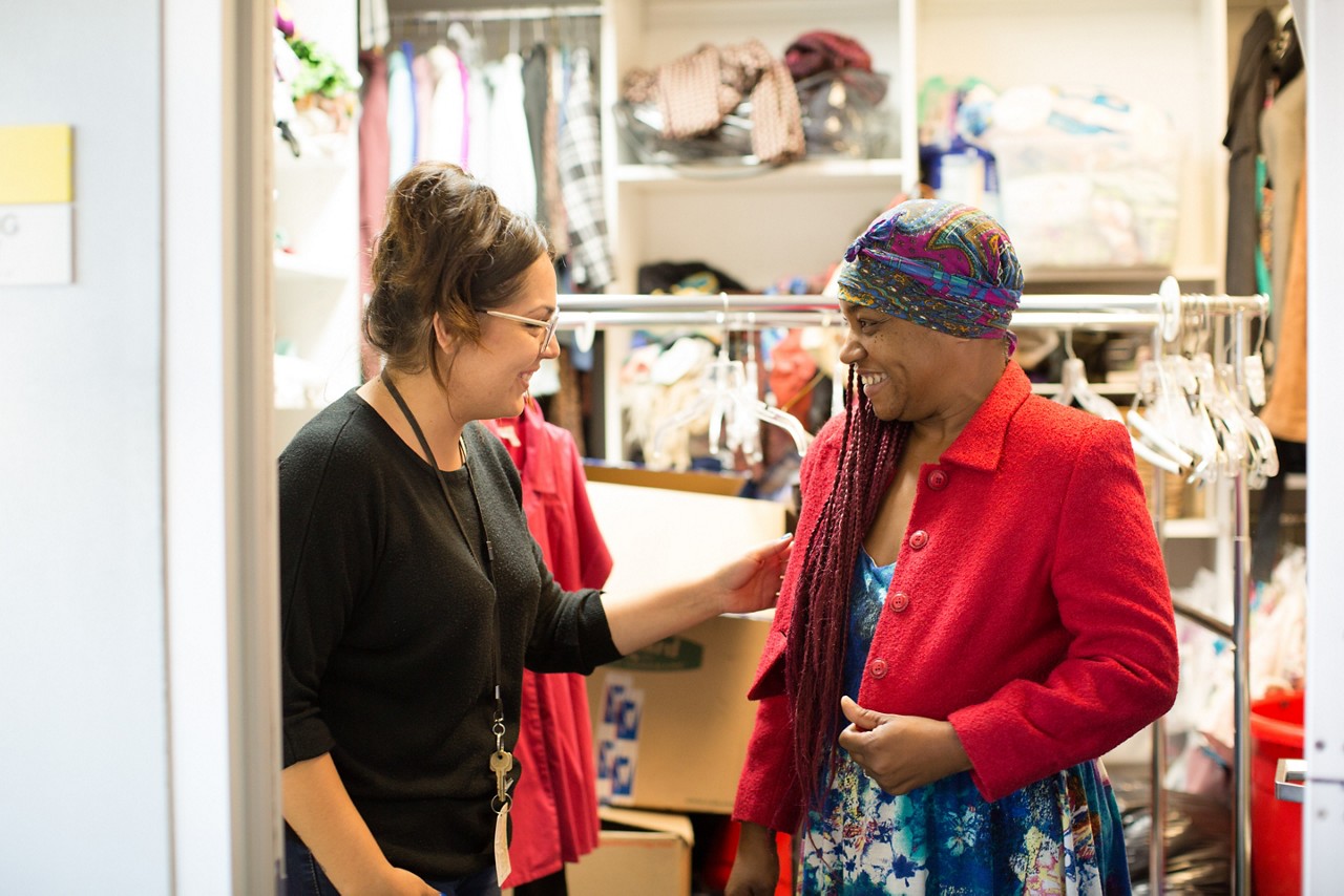 Santa Monica 2016 Culture of Health. The Annenberg Access Center handles homeless intake and is the first step for people who need help. The center has showers, food and clothing. Jennifer (staff) aids Cheri (client) with clothing.