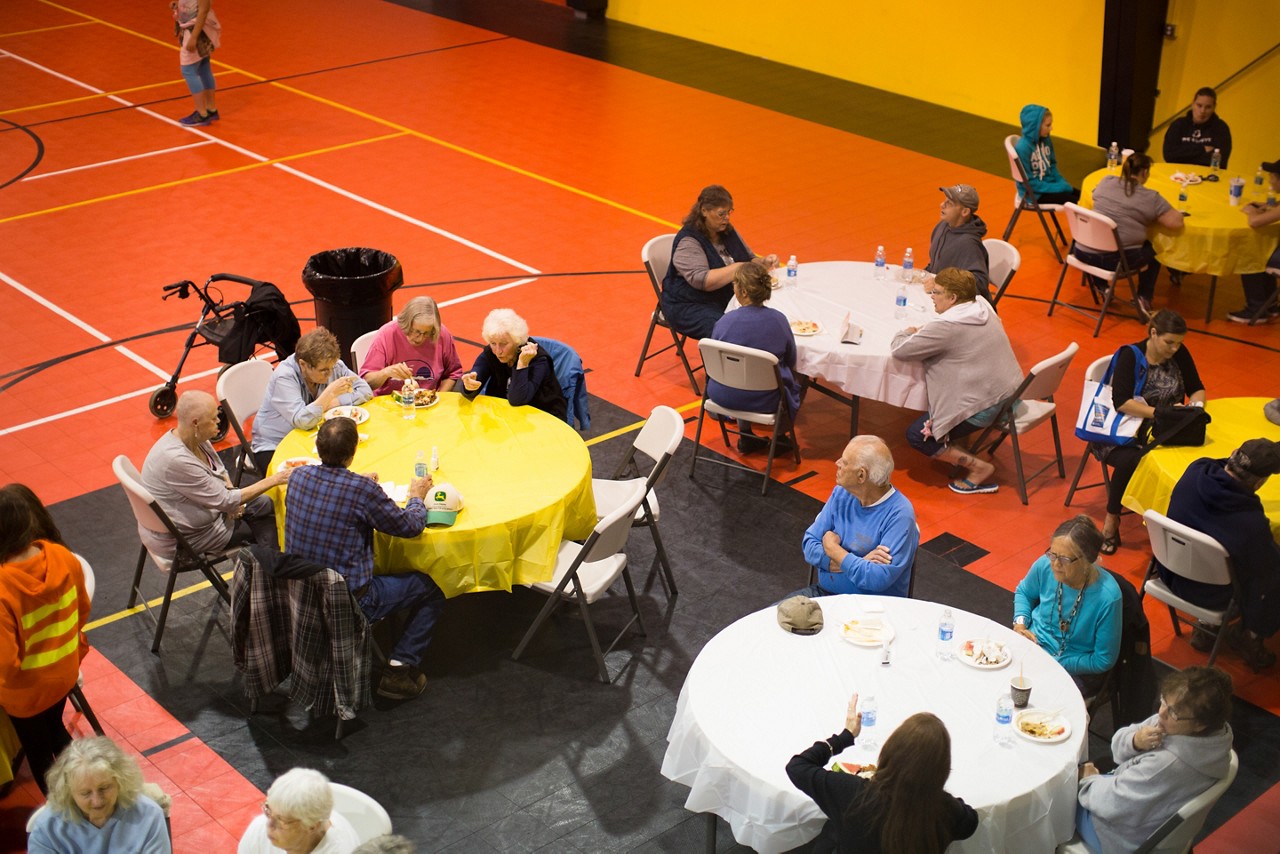 The community meal brings together a diverse group with many ages and ethnicities.