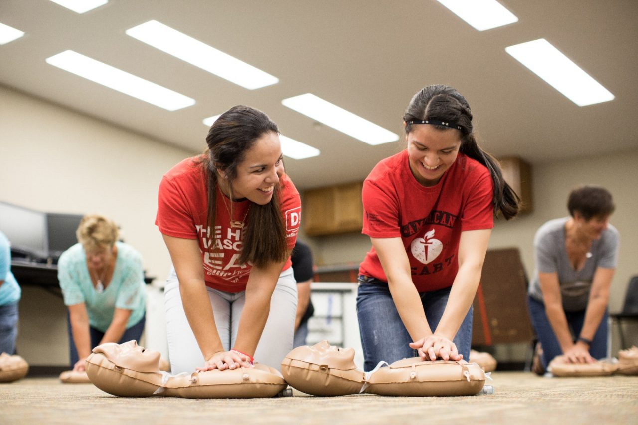 Algoma, WI COH 2017. Sisters Daniela Gomez (left) and Jackie Gomez (right) teach the class on Hands Only CPR.