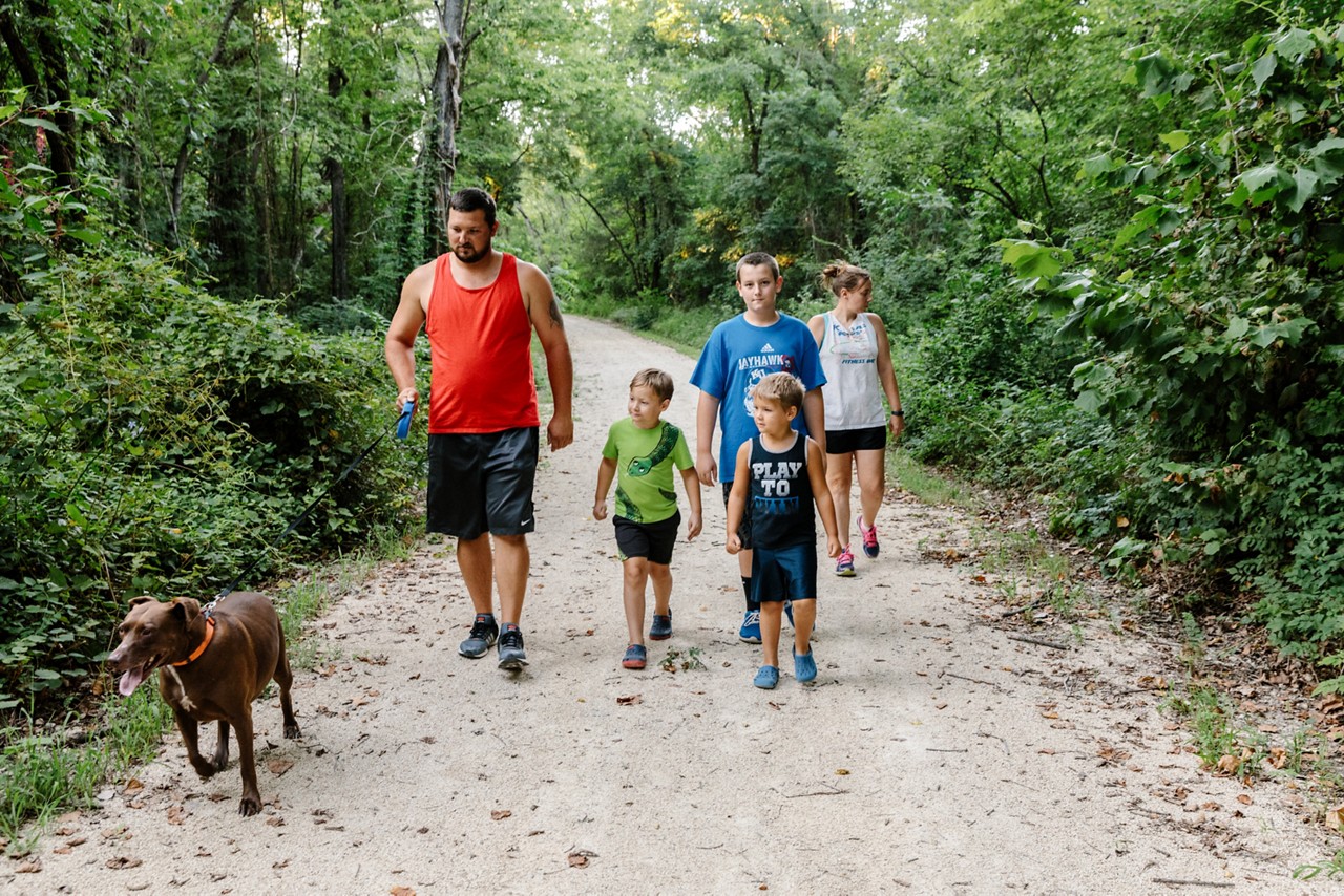 Michael and Kim Boeken walk with their family.