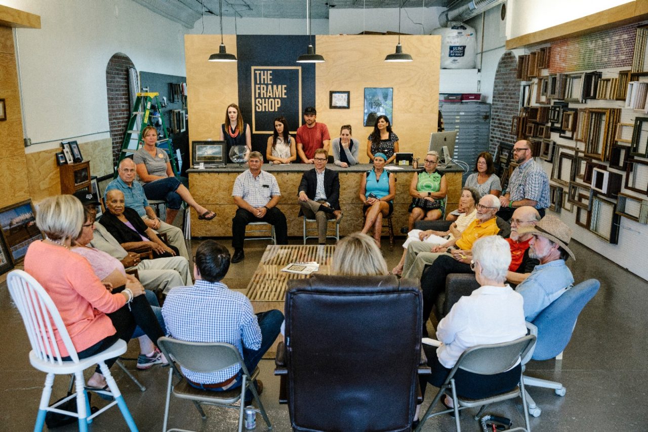 Humboldt, KS - July 31, 2017 - David Toland (center), CEO of THRIVE Allen County, leads a community conversation at a frame shop in downtown Humboldt.