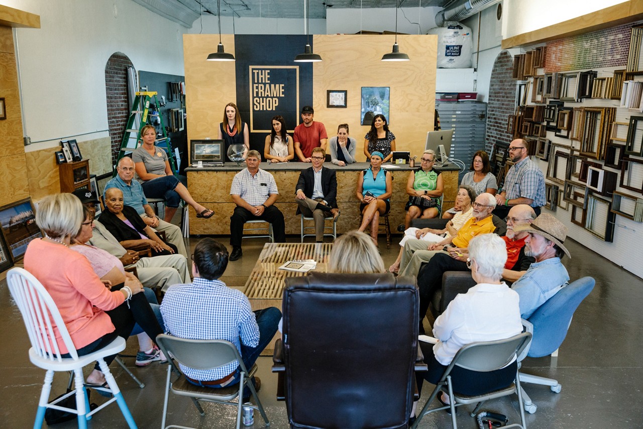 Community town hall meeting in a retail store. 