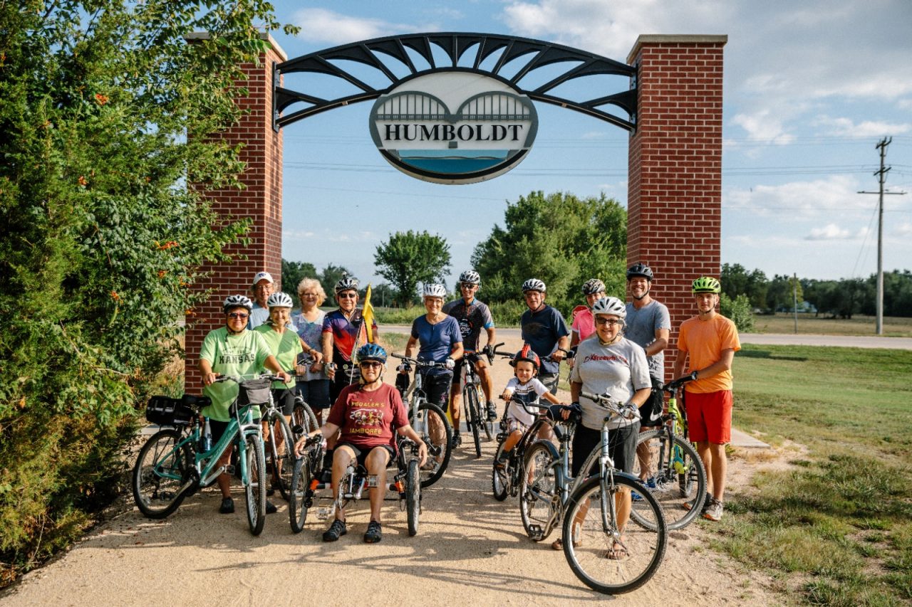 A group of cyclists on bikes in Allen County pose for a picture. 