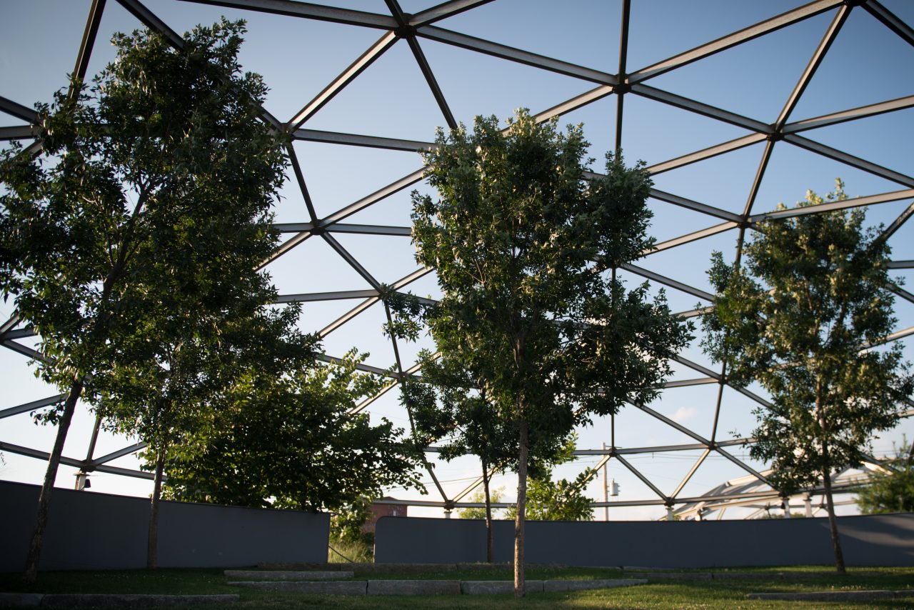 A welcoming community parks and recreation area lined with trees.