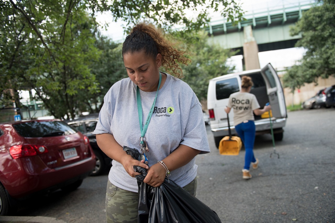 naluis Sosa (center), a supervisor with the youth-serving organization Roca.