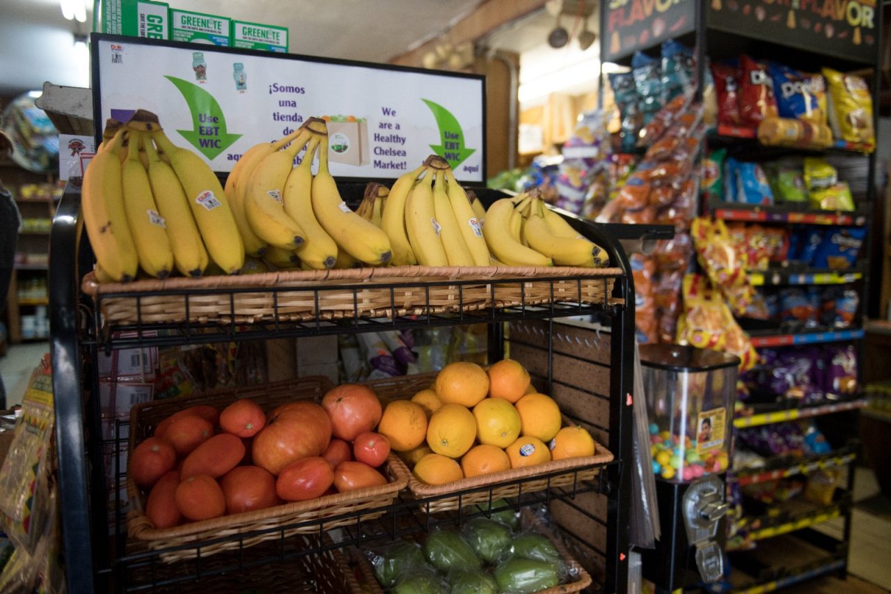 A fruit and vegetable display inside a Chelsea corner store.