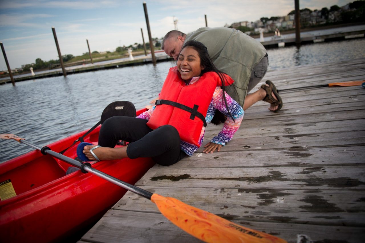 Isabella Cusick, 13, gets out of a kayak after taking it out on Chelsea Creek.
