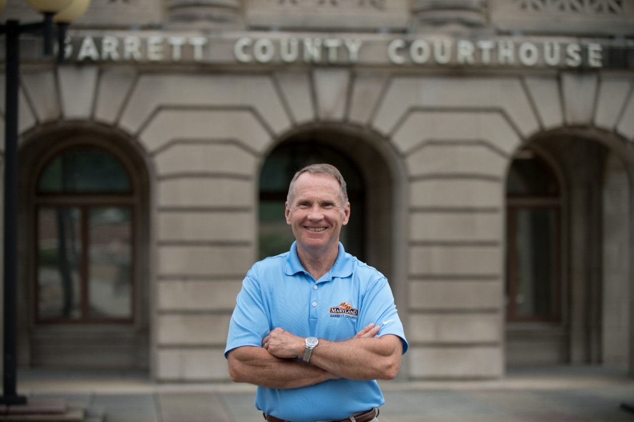 County Commissioner Jim Hinebaugh in front of the historic Garrett County Courthouse. 
