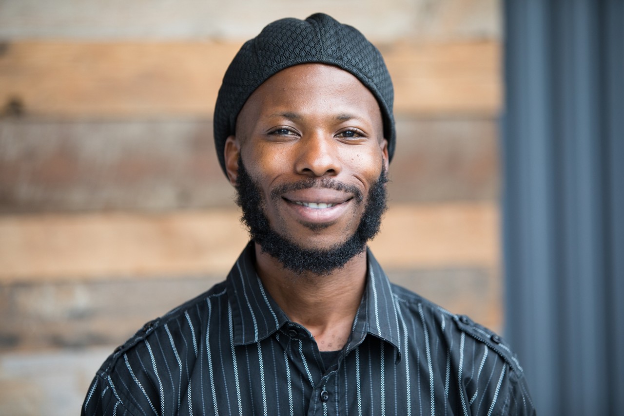 A smiling man posing for a photo.