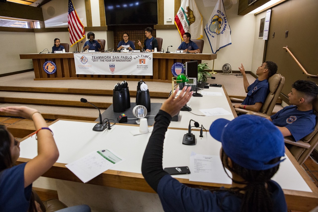 Students participate in a youth commission meeting. 