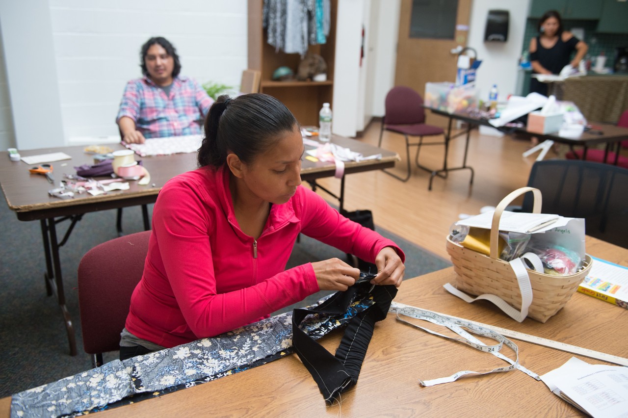 Brittany Ann Maybee sews a garment in a community class. 