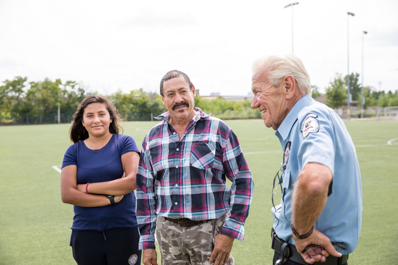 A police officer talking with residents.