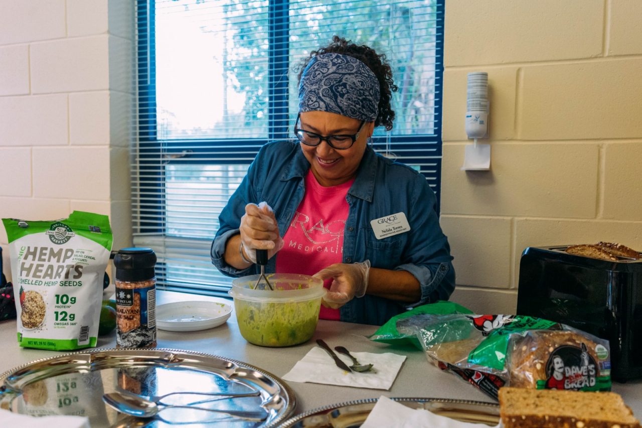 Woman participating in a cooking class.