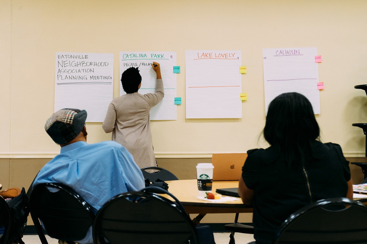 Residents take part in an activity led by Natalie Jones of the Polis Institute.