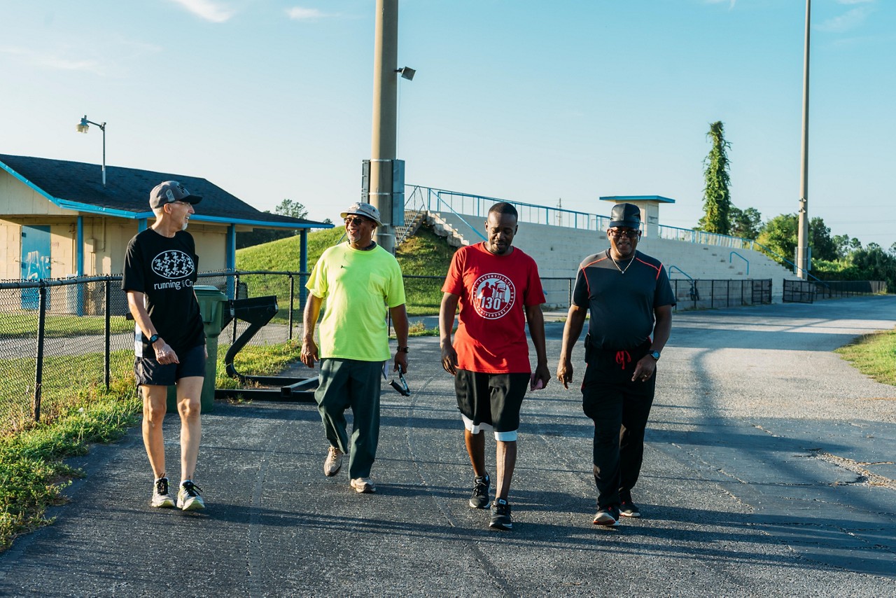 Neighbors walking together on a track.