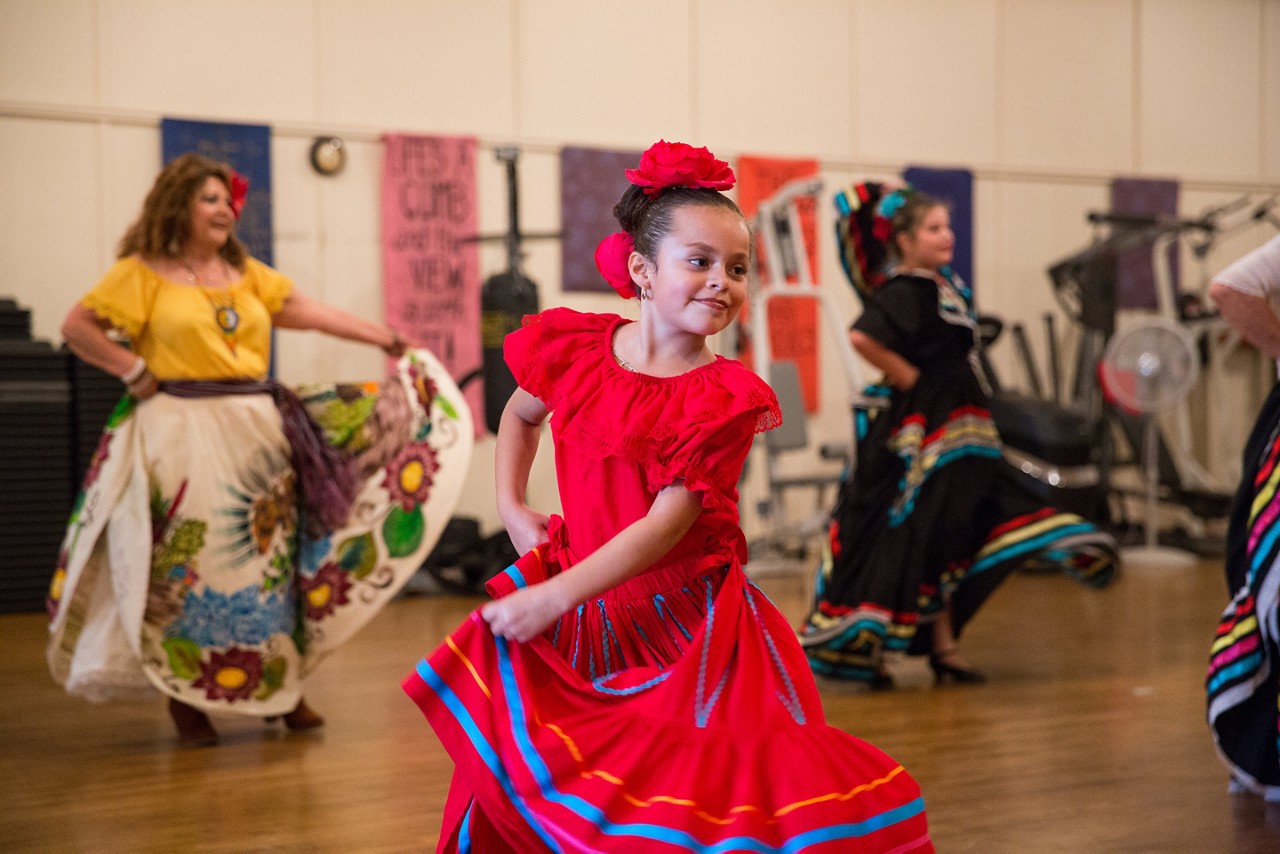 A girl performing with a dance group.