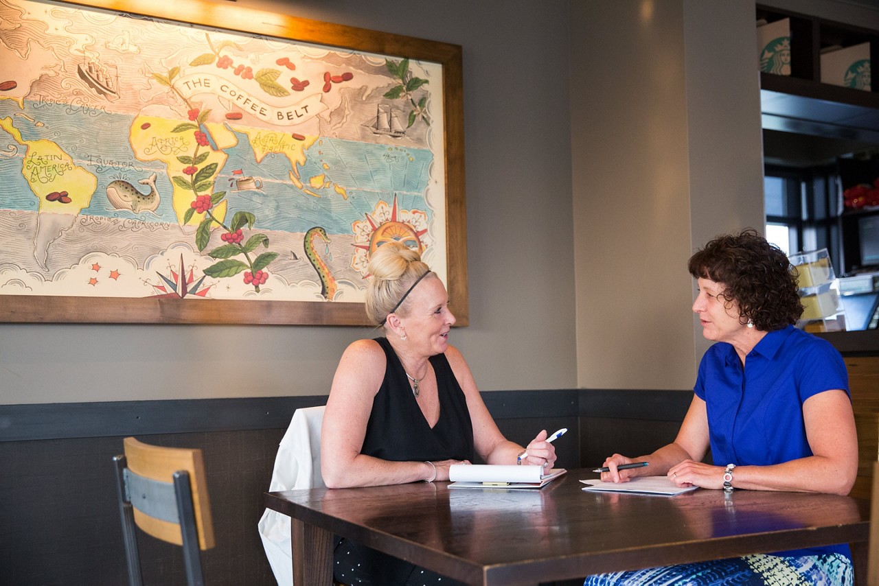 Two women meeting.