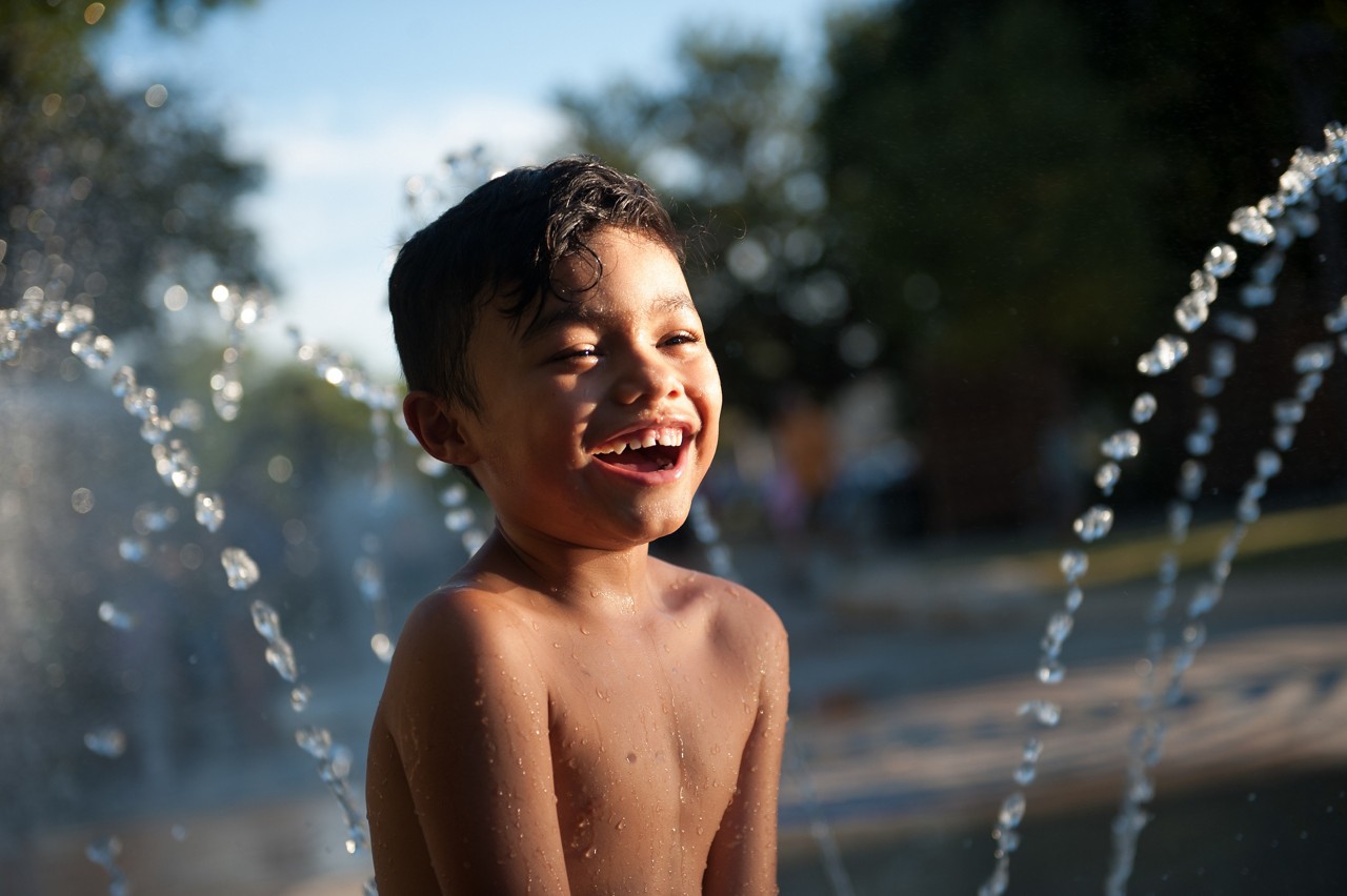 Kids playing on the splashpad in Yanaguana Park. Yanaguana is the newly renovated section of the Hemisfair.