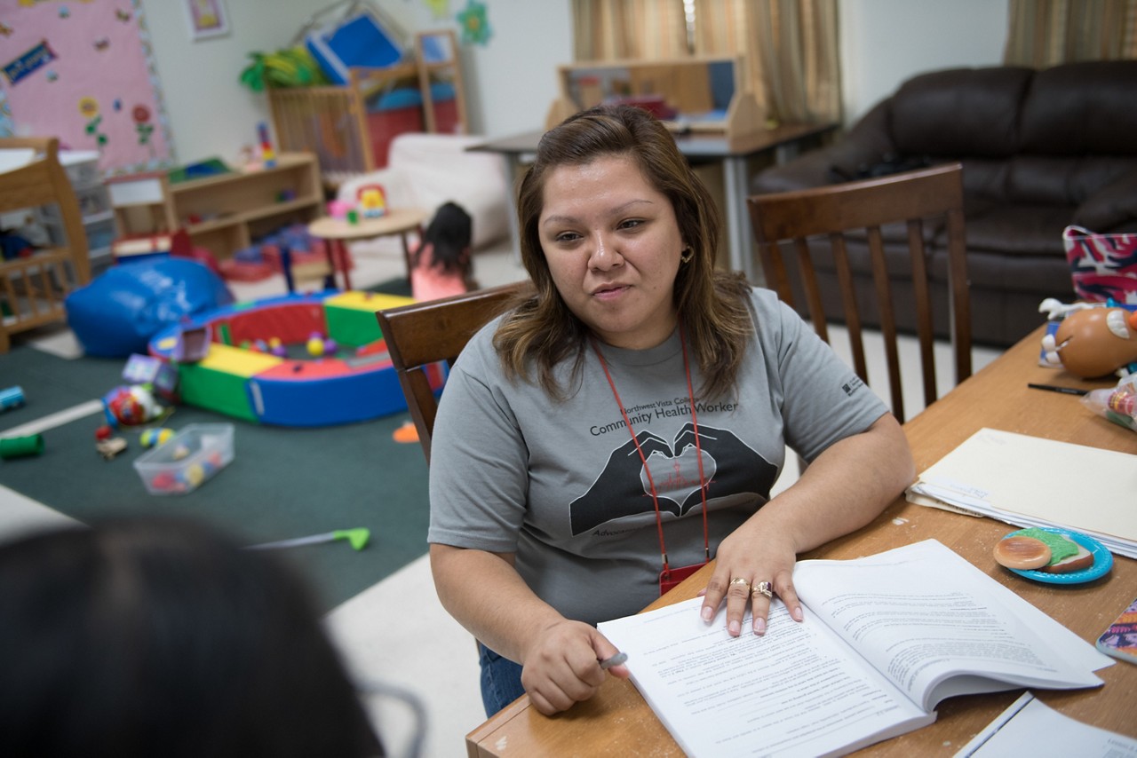 A promotora meets with a client to learn about her culture and figure out how to help support the needs of her and her family.