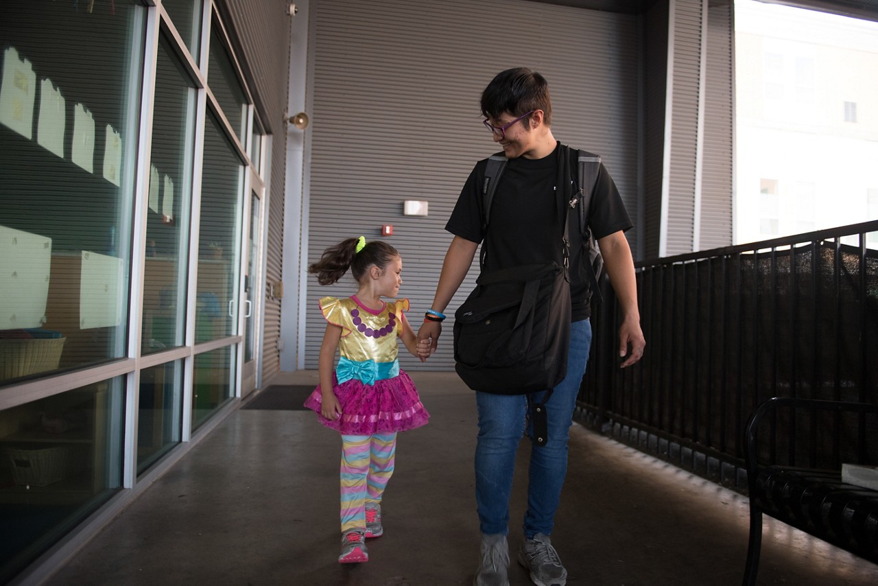 Nina drops her kids off at the YMCA for childcare before going to work.