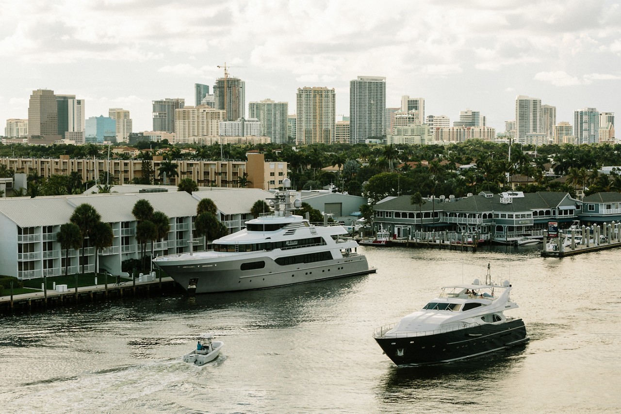 Fort Lauderdale, FL - August 21, 2019 - The skyline of downtown Fort Lauderdale is visible against one of the city's numerous canals.