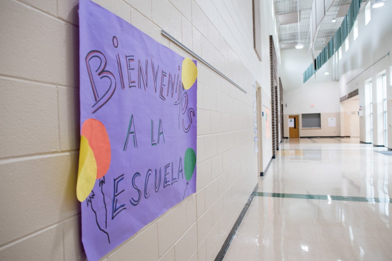 A sign welcomes students to Tanglewood Middle School in Spanish, where 40% of the students are Spanish-speaking. Tanglewood is participating in the OnTrack Greenville program to identify risky behaviors and better engage students.