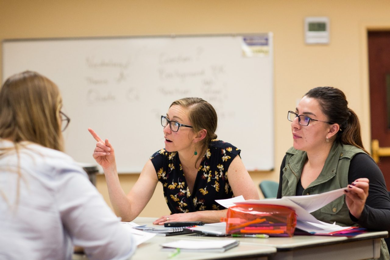 Erin Allaman, associate professor of teacher education at Colorado Mountain College in Leadville, Colorado talks with student Analy Gurrola during an Introduction to Education class.