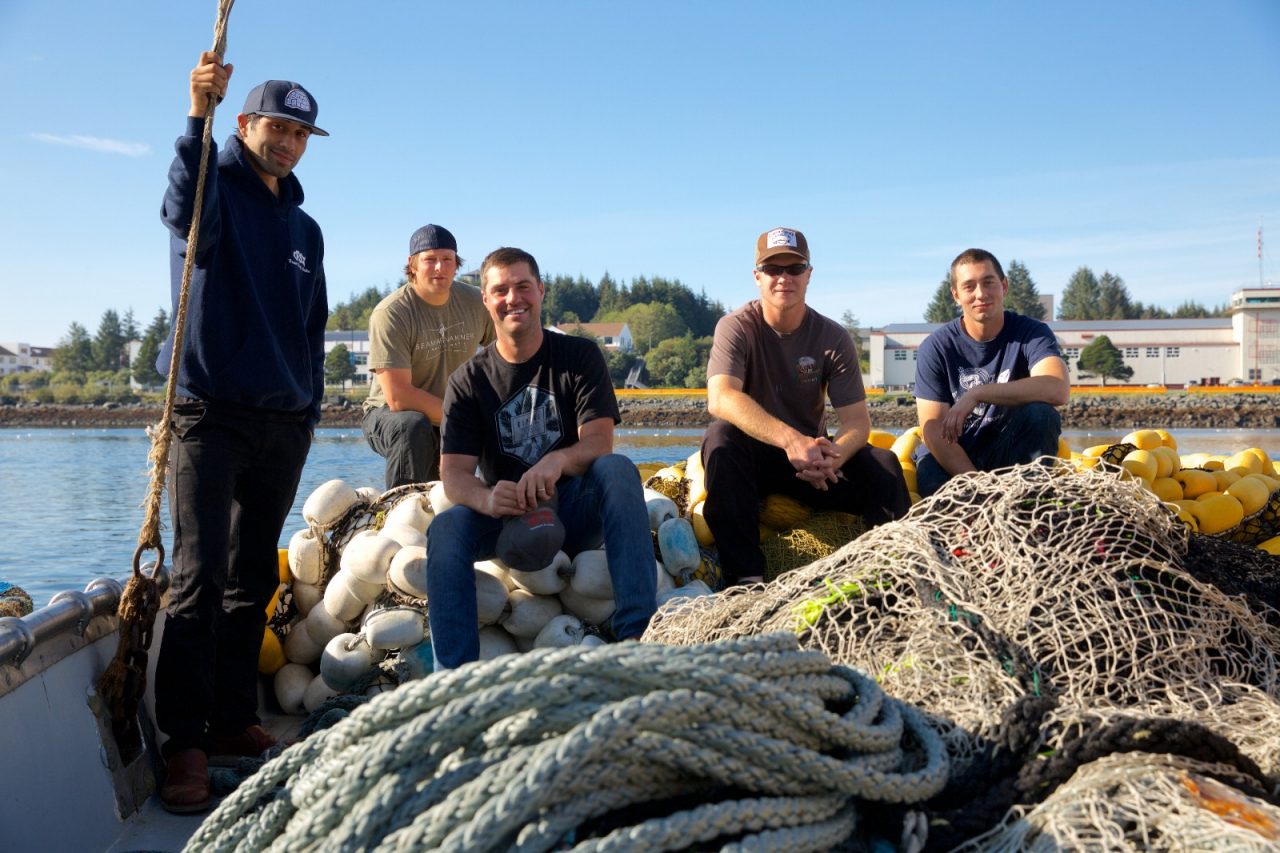 SITKA, ALASKA - SEPTEMBER 2019: Fishermen Matthew Q. Kinney, Flune Schonberg, Will Patrick, Matt Way, Bae Widmier preparing their boat before heading out to sea.