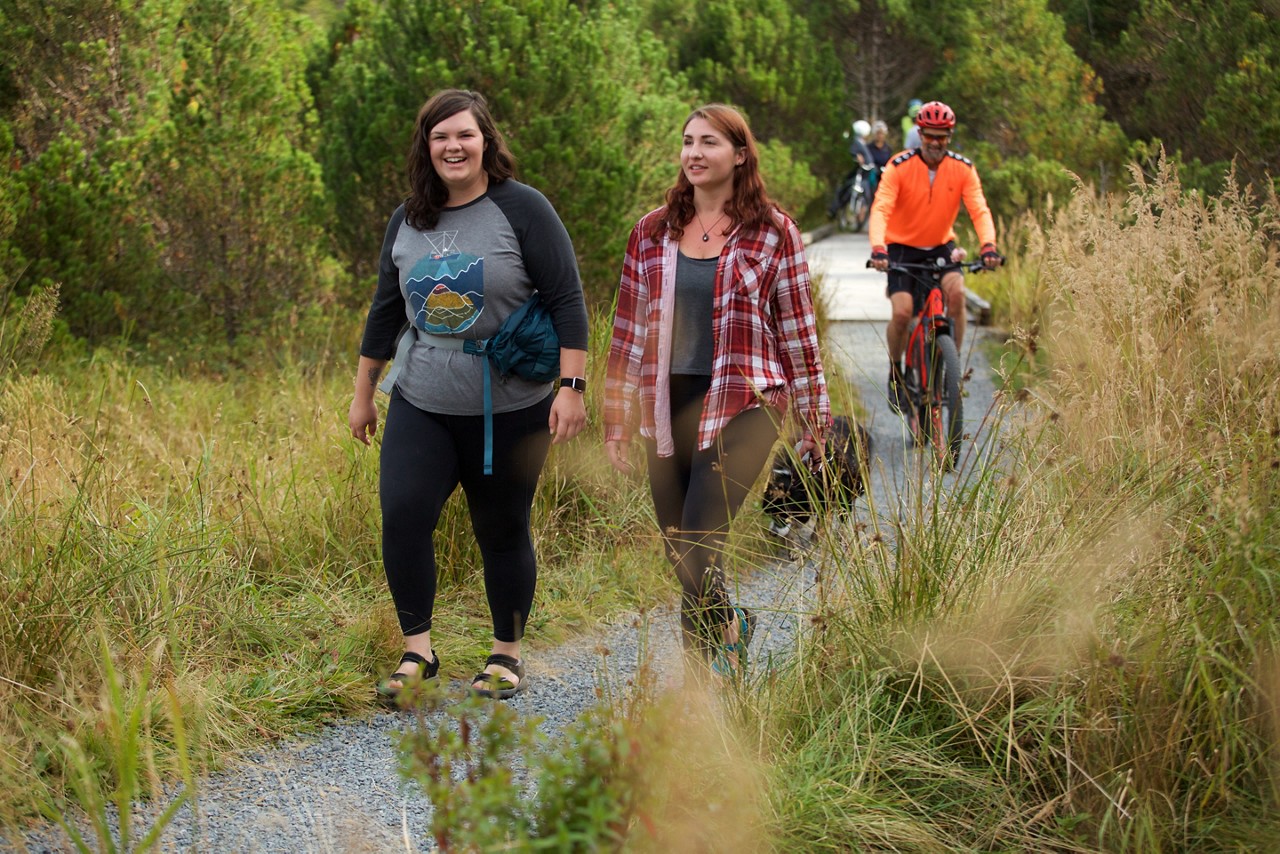 Tina Bachmeier (left) and Eleyna Rose hike on Sitka’s Cross Trail.