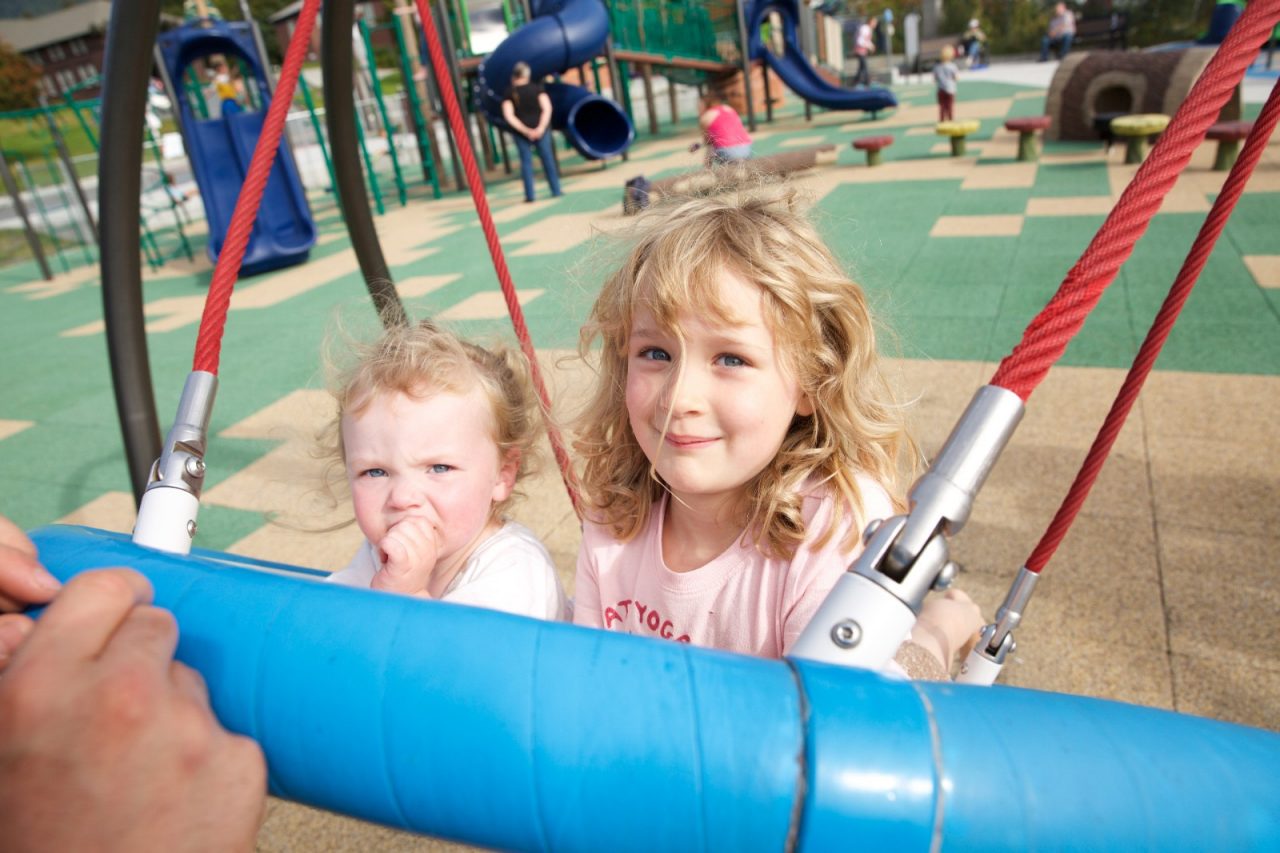 Oleanna Graham (left) and Jesslyn Workman enjoy the Sitka Community Playground.